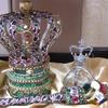 Small Kingdom Warrior Crown set $175. Open wire frame Crown trimmed in camouflage ribbon and jeweled; Base of emerald green Lame' and gold trimmings; 2' Warrior Designer Scepter wrapped in camouflage ribbon and elaborately jeweled, and Orb will be decorated to match.