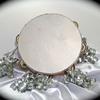 Wisdom Tambourine med. $20. Silver metallic covered (goatskin on Willowwood) tambourine with matching silver curl ribbon.