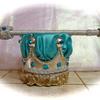 Divine Revelation 2pc Crown set $45. Silver metallic crown, topped in Turquoise satin fabric, turquoise jewels and silver sequins/braid trim. 1ft scepter wrapped in silver fabric and sequins, turquoise jewels and matching silver trim (base not included)